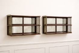 A pair of John McLean of London two-tier mirrored-back shelves, circa 1810, featuring fine turned