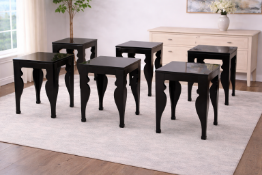 A set of five side tables featuring a high-gloss, ebony polished black finish. Each table is