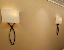 A pair of large-scale wall sconces inspired by the Nicolas Aubagnac SALSA I design. Each fixture