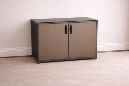 A two-door cabinet featuring embossed woven-texture fascia panels and dark vertical pull handles,
