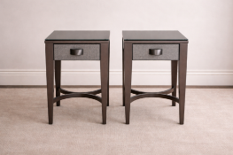A pair of matching nightstands, each featuring a single drawer with a grey textured woven front