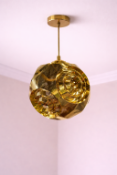 I-Lite Curve-Inspired Gold Ball Pendant This I-Lite Pendant Lamp is a striking geometric sphere