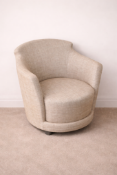 Sancal Spain curved armchair upholstered in a neutral tan woven fabric. The chair features a