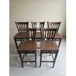 Set of 5 Dark-Stained Solid Wood Stools This set of five professional-grade stools is crafted from