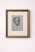 A framed monochrome print, likely from an etching or lithograph, featuring a head study of an