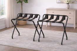 A pair of industrial-style luggage racks, constructed from durable grey powder-coated metal