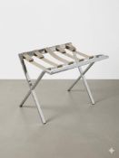 Mertnk folding luggage rack constructed from polished stainless steel, featuring a sturdy X-frame