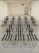 A large quantity of 19 x chrome luggage racks, featuring a bright, high-polish finish. Each rack