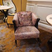 Tatiana Modernist Accent Chair The Tatiana chair is a striking modernist piece defined by an