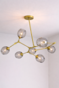 I-Lite Lindisfarne-Inspired Gold and Smoked Glass Chandelier This I-Lite Pendant Lamp is a