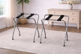 A pair of narrow luggage racks, featuring a high-polish chrome finish for a clean, modern look.