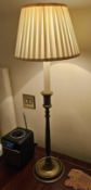 A pair of George III–style antique brass candlesticks in the Adam manner, each cast in an elegant