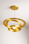 I-Lite Pendant Lamp Gold features a contemporary triple-ring design suspended by adjustable steel