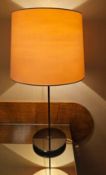 A contemporary table lamp by Barovier & Toso, defined by its minimalist silhouette and refined