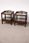 A pair of mahogany nightstands featuring a galleried top with an inset shaped mirror plate,