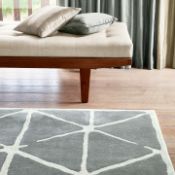 Haldon Rug A masterclass in geometric dynamism and tactile luxury, this bespoke hand-tufted rug by