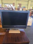A 26-inch Toshiba 26WLT66S LCD television in a classic mid-2000s style, featuring a matte black