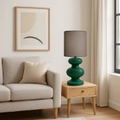Bambini Table Lamp The Bambino Table Lamp is a study in organic form and bold color, designed to