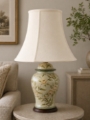 A Chinese style ceramic ginger jar table lamp featuring an ivory-coloured crackle-glaze finish.