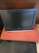 A Toshiba 20HLV16 LCD TV with integrated DVD player, featuring a 20-inch screen and a silver-tone