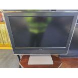 A 26-inch Toshiba 26WLT66S LCD television in a classic mid-2000s style, featuring a matte black