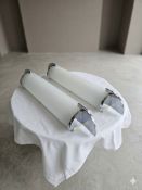 A pair of premium contemporary linear bathroom wall sconces of sleek, architectural form, attributed