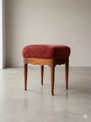 A vintage walnut upholstered dressing stool or occasional footstool of refined Queen Anne design.