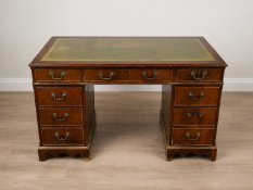 A late 20th-century style mahogany twin-pedestal partner-style desk of classic Georgian design.