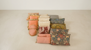 A selection of 17 luxury contemporary and traditional scatter cushions. This diverse mix features