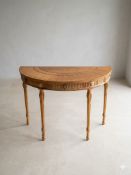 A satinwood reproduction demi-lune console table of fine George III Hepplewhite design, produced