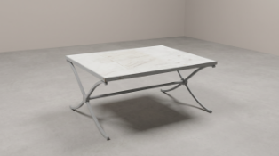 A contemporary rectangular low coffee table of modernist industrial design. The substantial table