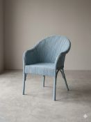 A contemporary Lloyd Loom style woven wicker tub armchair, finished in an attractive pastel duck-egg