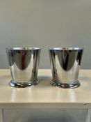 A matching pair of contemporary stainless steel ice buckets / wine coolers. Each piece features a