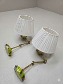 A pair of premium contemporary polished brass extending swing-arm wall sconces of classic