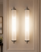 A pair of premium contemporary linear bathroom wall sconces of sleek, architectural form, Each