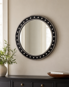 A Contemporary Chic Circular Wall Mirror An eye-catching, round porthole-style wall mirror featuring