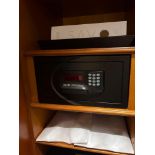 A JSH digital room safe featuring a textured matte black steel construction, a front-access