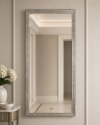 Contemporary Silver Mirror A refined contemporary frame finished in a metallic silver-gilt