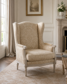 A Louis XVI Style Carved Beechwood Wingback Armchair (Bergère à Oreilles) A high-back winged