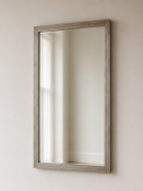 A Modern Silvered Rectangular Vanity Mirror A sleek wall or vanity mirror featuring a vertical,