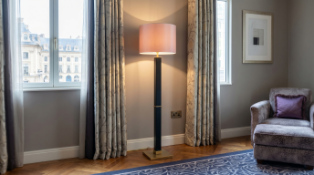 A Mid-Century Style Walnut and Antiqued Brass Floor Lamp by Zonca Voghera An exceptional designer