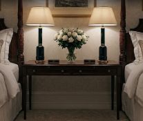 A Pair of Neoclassical Style Jacaranda and Faceted Green Glass Table Lamps Each table lamp