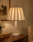 A Neoclassical Style Carved Alabaster Column Table Lamp The lamp features a figured, translucent