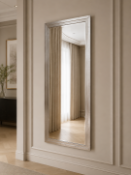 A Modern Silvered Rectangular Wall Mirror The sleek full-length or console wall mirror features a