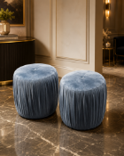 A pair of Contemporary Pleated Velvet Cylinder Pouffe A compact, circular upholstered pouffe or