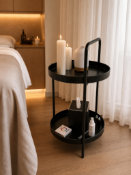 Two-Tier Metal Circular table A minimalist, industrial-style circular table featuring a two-tier