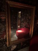 A grand, rectangular overmantel mirror of substantial proportions, presented in a richly decorated
