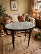 A high-poser bar table featuring a thick polished marble top panel, securely mounted on a tall