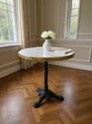 A French Style Round Bistro Table with Cast Iron Base A classic reproduction cafe or bistro table in