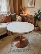 A contemporary bistro or café table featuring a heavy polished marble top panel, supported by a